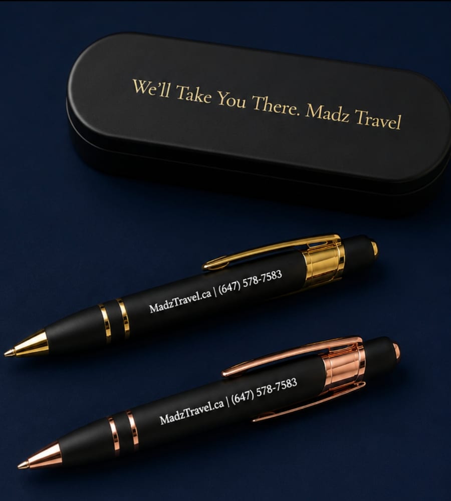 Madz Travel branded pen set in a black case engraved &ldquo;We'll Take You There. Madz Travel&rdquo;, with MadzTravel.ca and 647-578-7583 on each pen